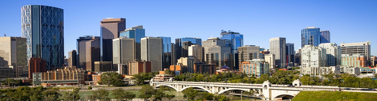 Individuals celebrating sobriety with arms raised, symbolizing the transformative journey of alcohol addiction treatment in vibrant Calgary, Alberta